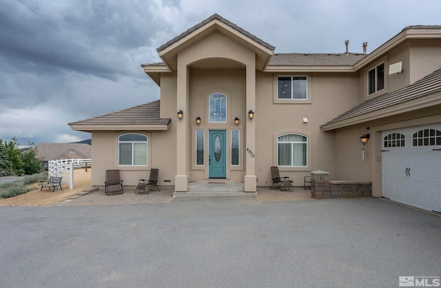 view of front of property with a garage