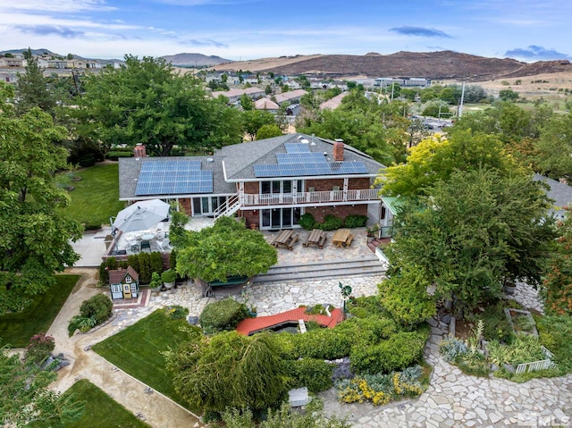 birds eye view of property with a mountain view