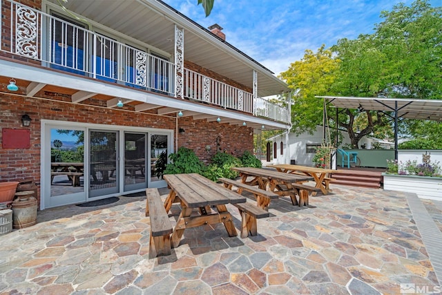 view of patio with a balcony