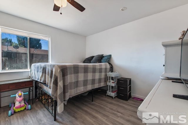 bedroom featuring hardwood / wood-style flooring and ceiling fan