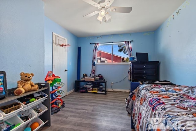 bedroom featuring ceiling fan and wood-type flooring