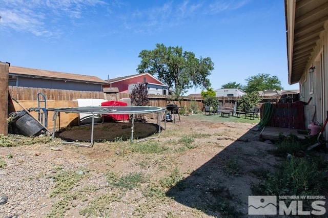 view of yard featuring a trampoline