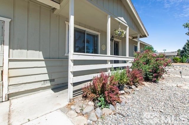 view of side of property with a porch