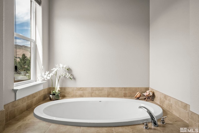 bathroom featuring a relaxing tiled tub