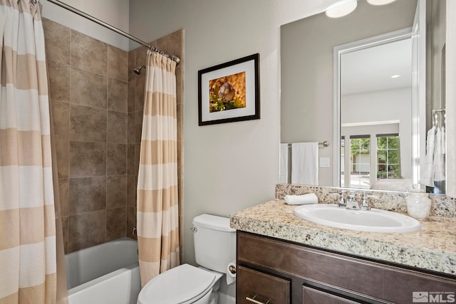 full bath with toilet, shower / bath combination with curtain, and vanity