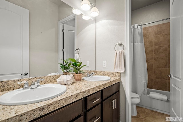 full bathroom with toilet, a sink, tile patterned floors, double vanity, and shower / bath combo