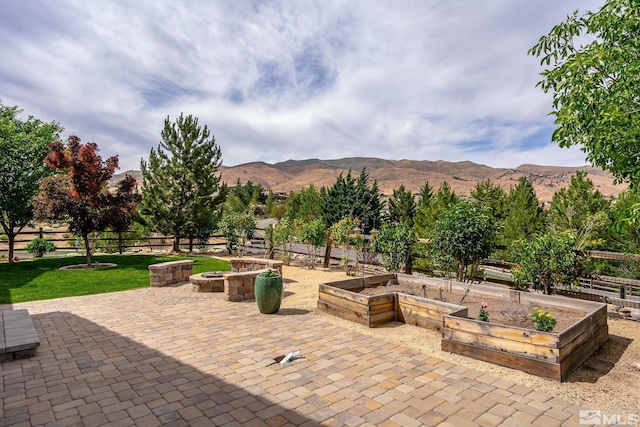 view of patio / terrace featuring a mountain view