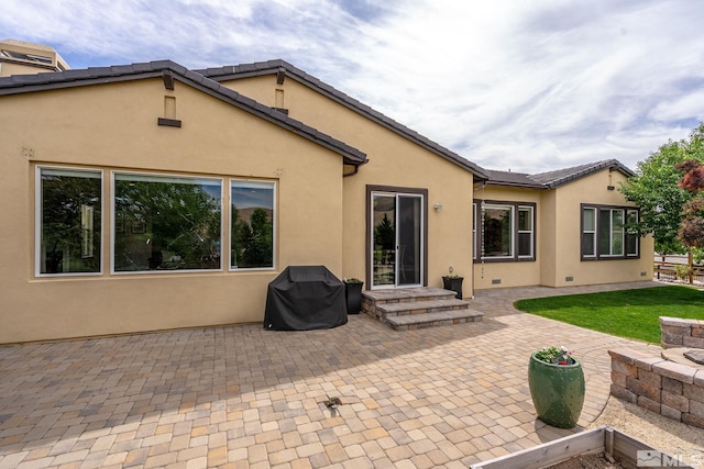 back of house with a patio area