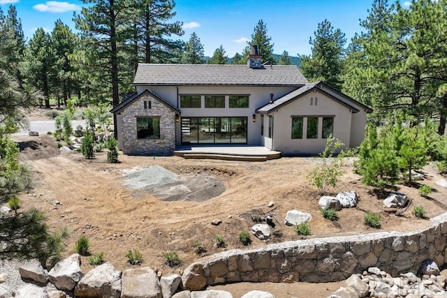 rear view of property featuring a patio