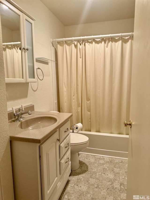 full bathroom featuring vanity, shower / bath combination with curtain, and toilet