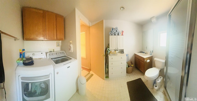 clothes washing area with washer and dryer and sink