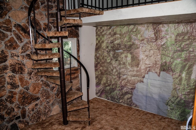 stairs featuring carpet flooring and a towering ceiling