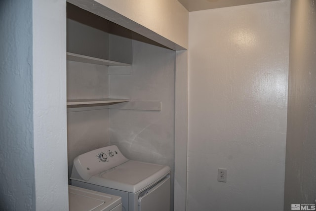 laundry area with independent washer and dryer