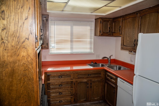 kitchen with white appliances and sink