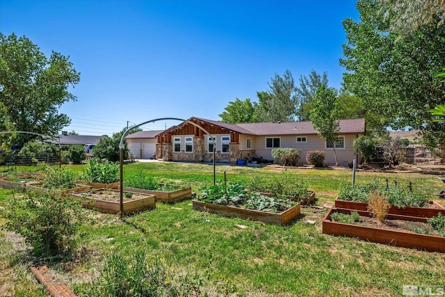 rear view of property featuring a lawn