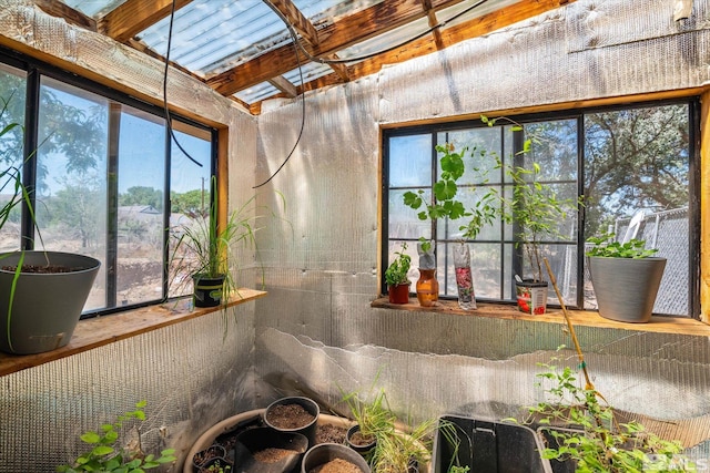 sunroom / solarium with a skylight and a wealth of natural light