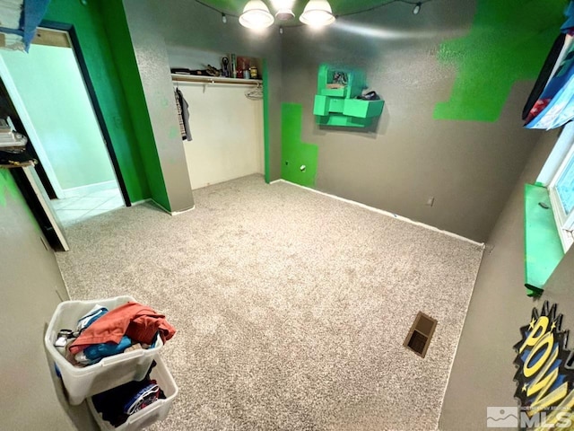 unfurnished bedroom with a closet and carpet floors