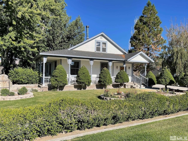 view of front of home featuring a porch and a front lawn