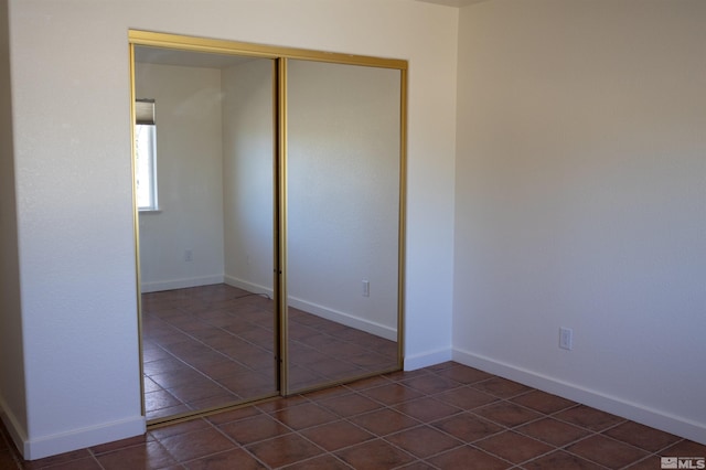 unfurnished bedroom with a closet