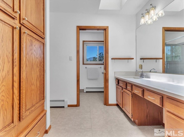 bathroom with vanity, a baseboard radiator, and walk in shower