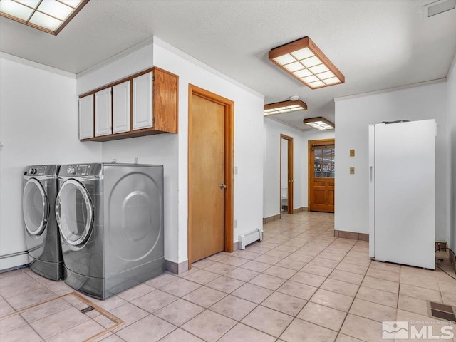 clothes washing area featuring cabinets, independent washer and dryer, baseboard heating, and light tile patterned floors