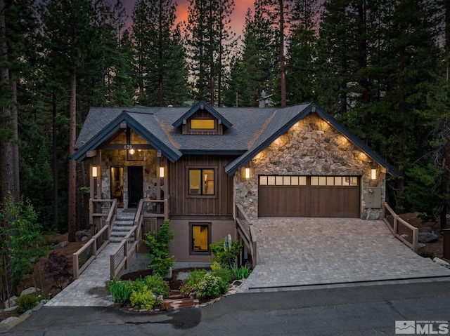 view of front facade with a porch and a garage