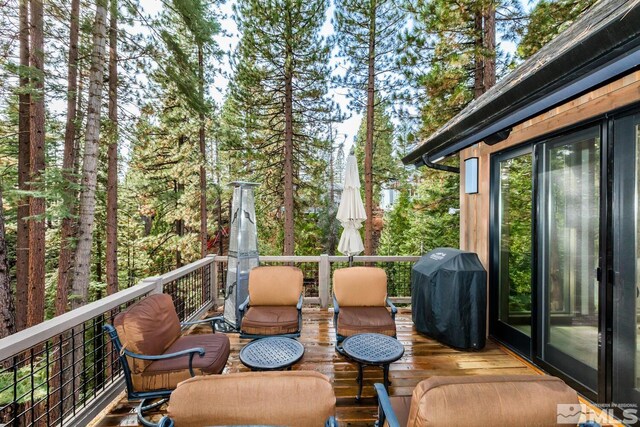 wooden terrace featuring grilling area