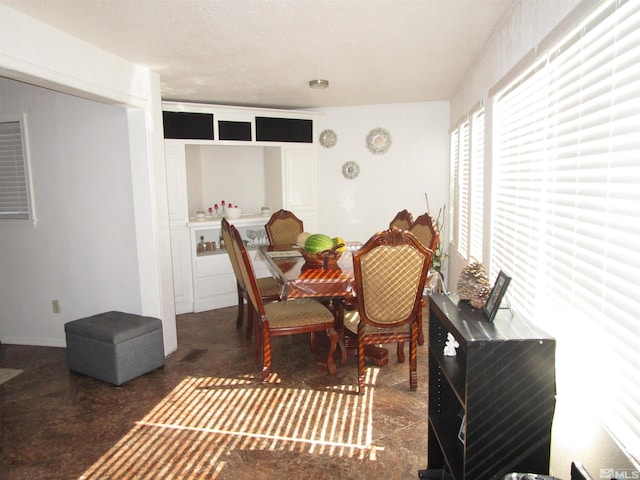 dining area featuring concrete floors