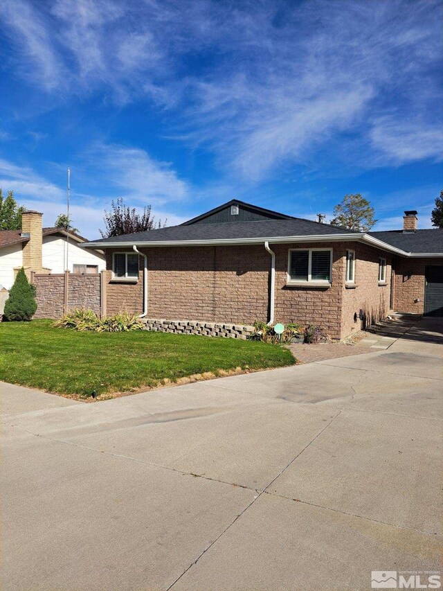 ranch-style house featuring a garage