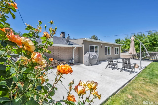 rear view of property with a patio area