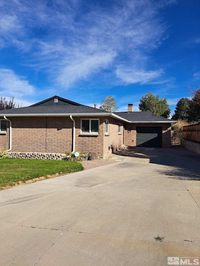 single story home featuring a carport