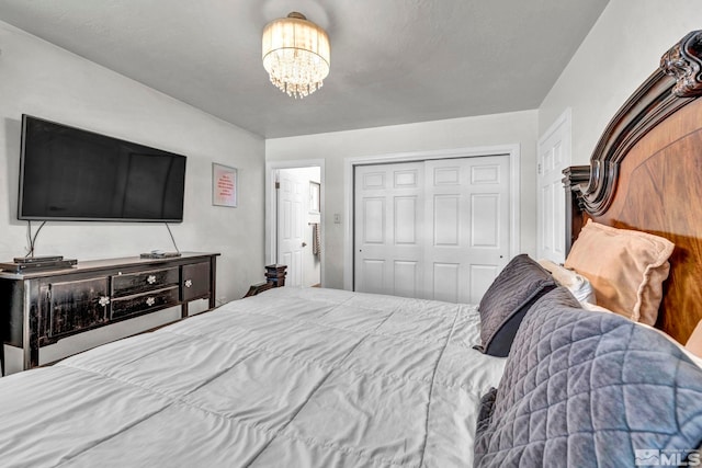 bedroom featuring a notable chandelier