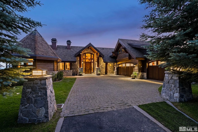 craftsman-style home featuring a yard