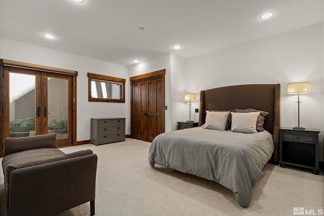 carpeted bedroom with french doors