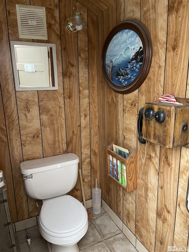 bathroom featuring tile patterned flooring and toilet