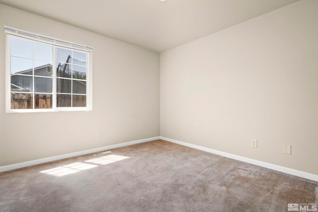 unfurnished room with carpet floors