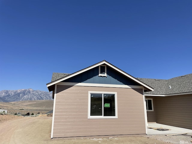 view of home's exterior with a mountain view