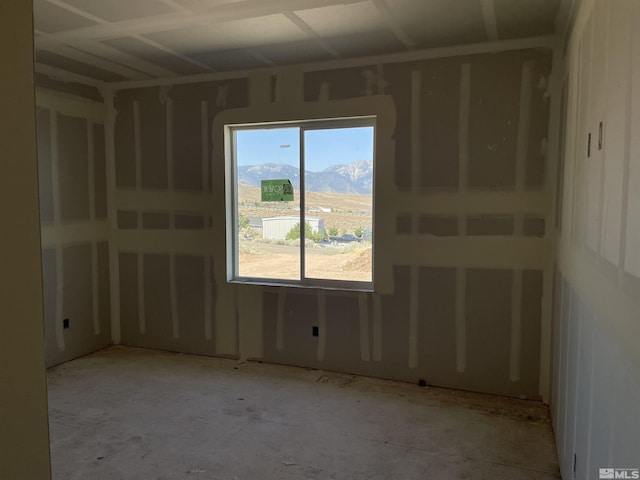 spare room featuring a mountain view