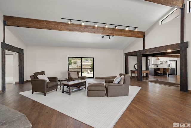 living room with vaulted ceiling with beams and dark hardwood / wood-style floors