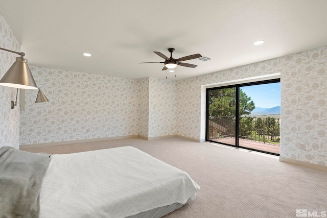 carpeted bedroom featuring ceiling fan and access to outside