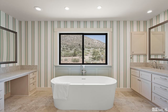 bathroom featuring a bathtub and vanity