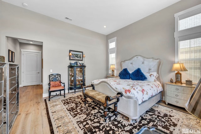 bedroom with light hardwood / wood-style floors