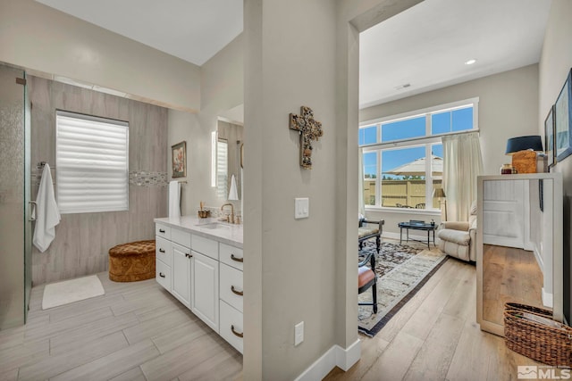 bathroom featuring vanity and plenty of natural light