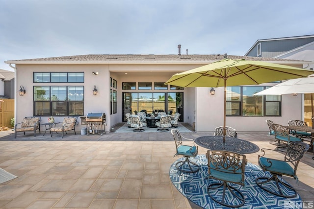 rear view of property with a patio area