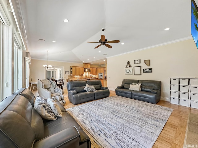 living room featuring light hardwood / wood-style floors, ceiling fan with notable chandelier, ornamental molding, and vaulted ceiling