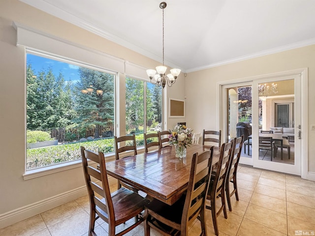 dining space with ornamental molding, an inviting chandelier, and light tile patterned floors