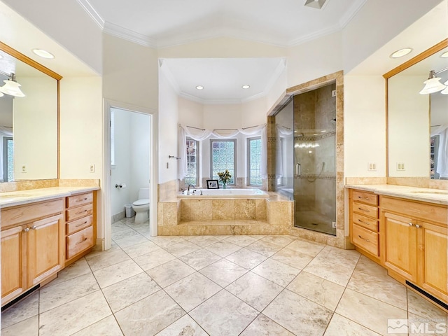 full bathroom featuring toilet, tile patterned floors, ornamental molding, vanity, and separate shower and tub