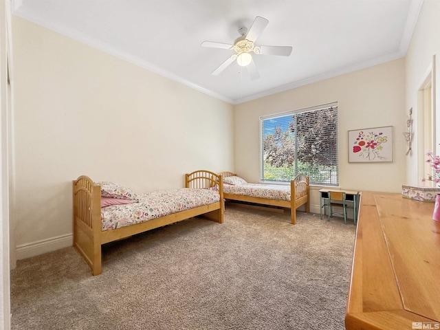 bedroom featuring ceiling fan, carpet, and ornamental molding