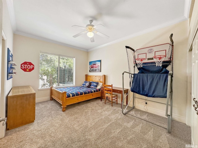 carpeted bedroom featuring ceiling fan and crown molding