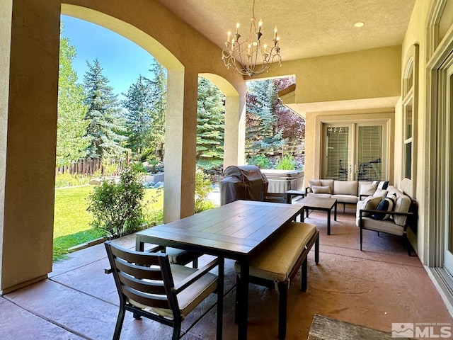 view of patio featuring area for grilling, a hot tub, and an outdoor hangout area